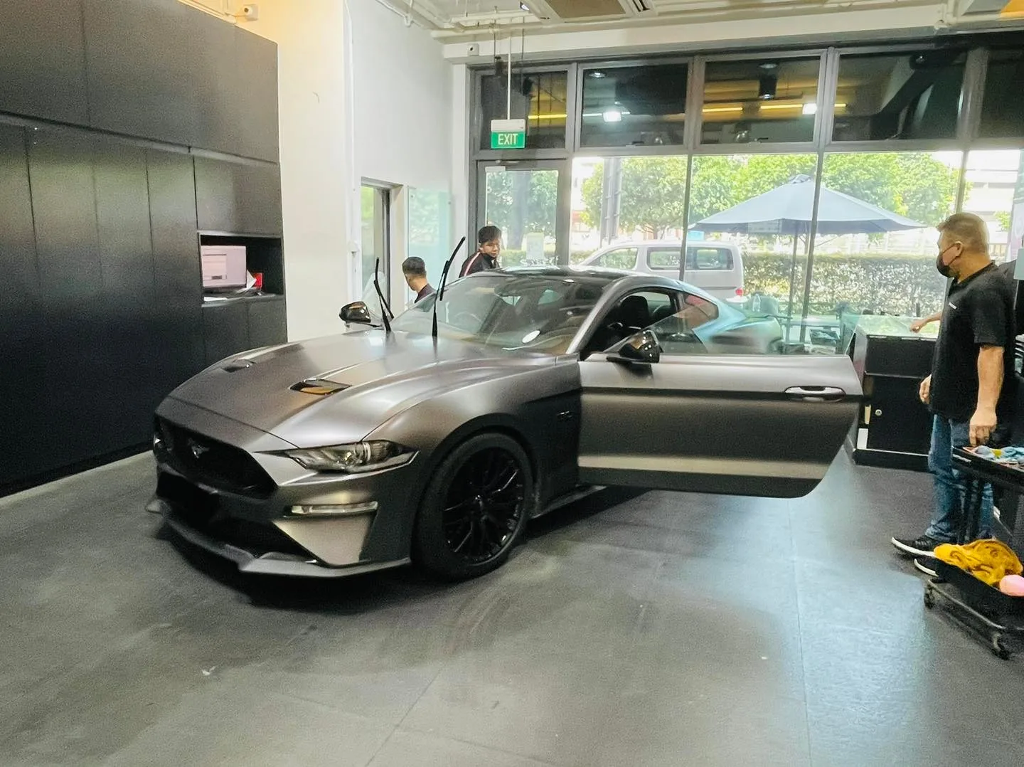 Grey Ford Mustang being tinted by the team at Infratint Singapore