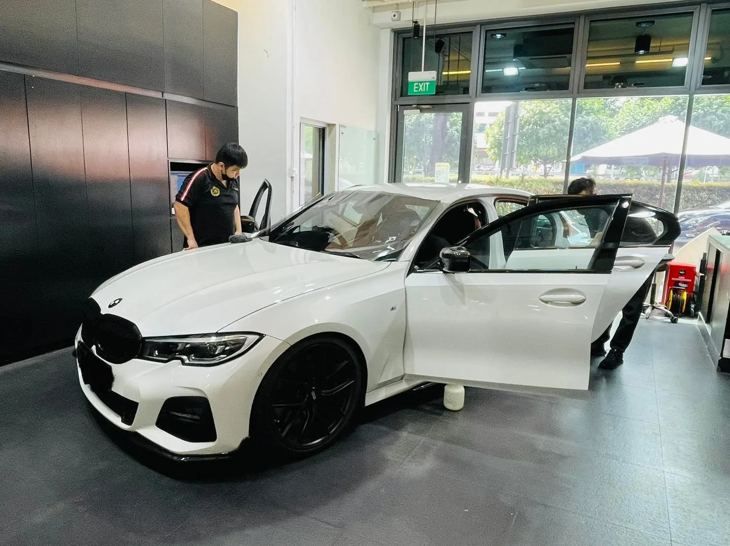White BMW 3 Series sedan front three-quarter view at Infratint Singapore