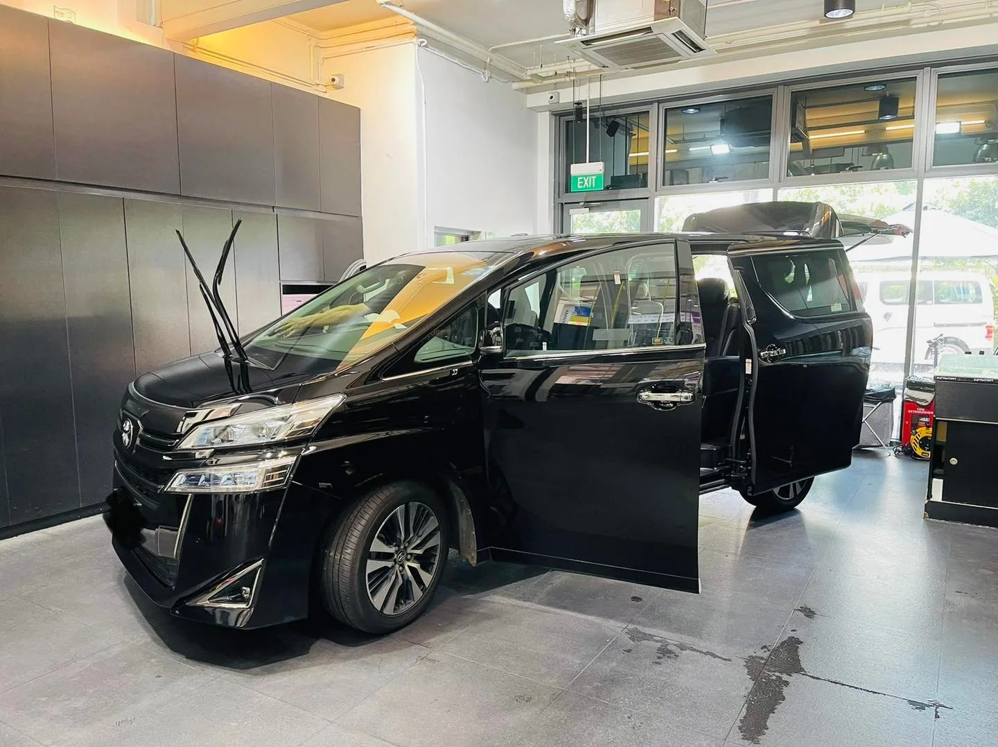 Black Toyota Vellfire MPV front three-quarter at Infratint Singapore