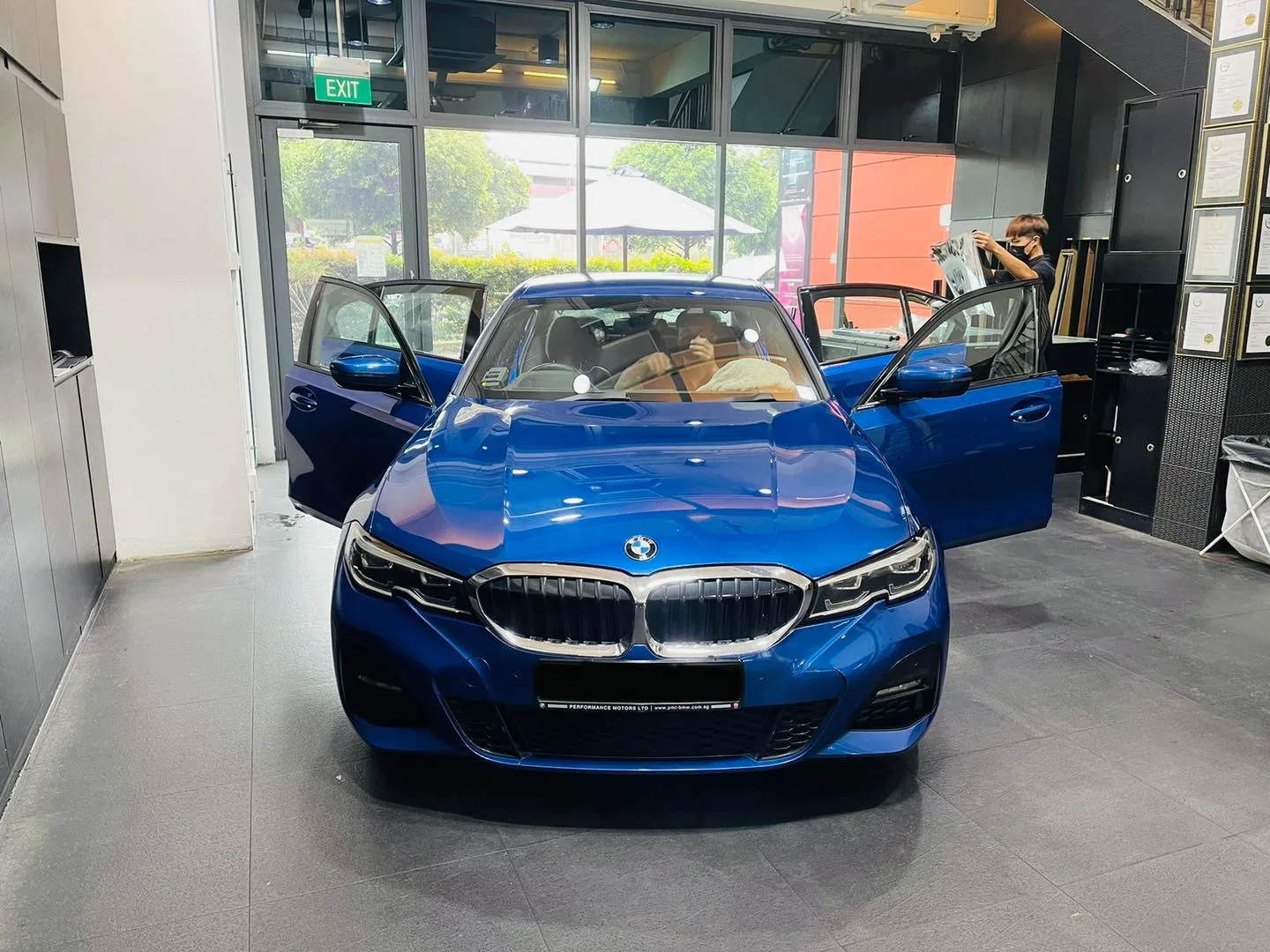 Blue BMW 3 Series sedan front view at Infratint Singapore