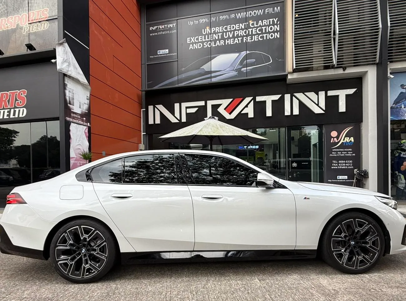 White BMW 520i side profile with tinted windows at Infratint Singapore
