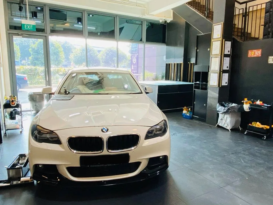 White BMW 5 Series sedan at Infratint Singapore ready for window tinting