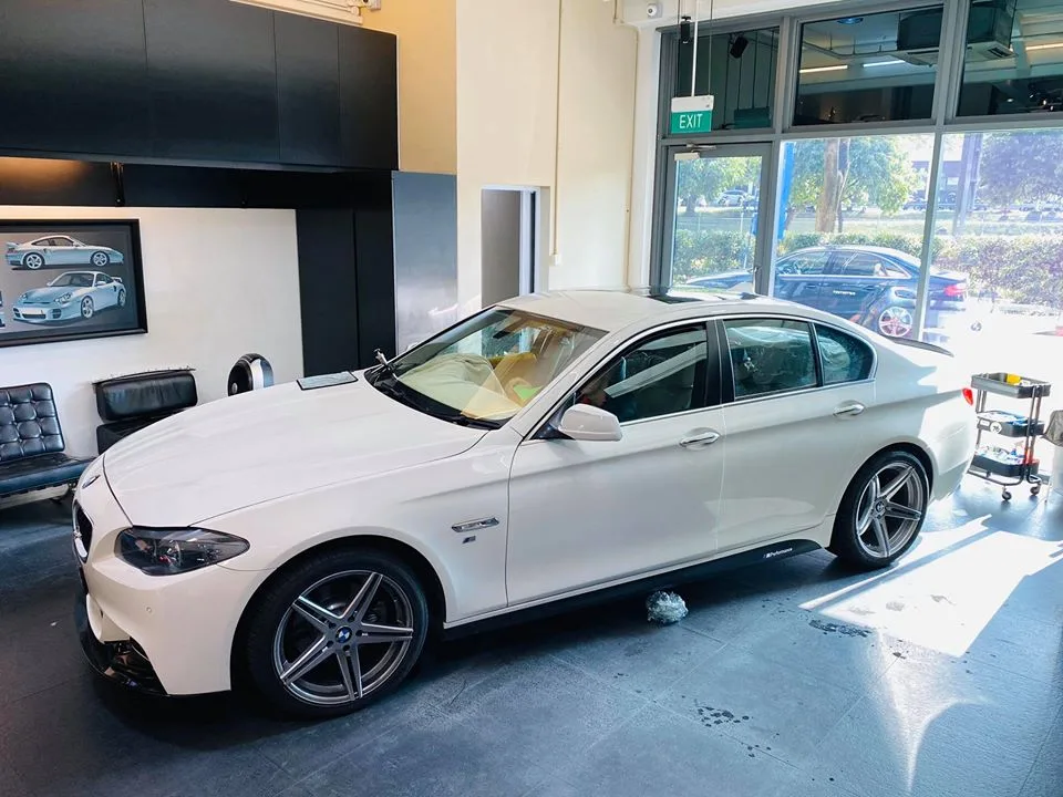 White BMW 5 Series sedan at Infratint Singapore for window tinting