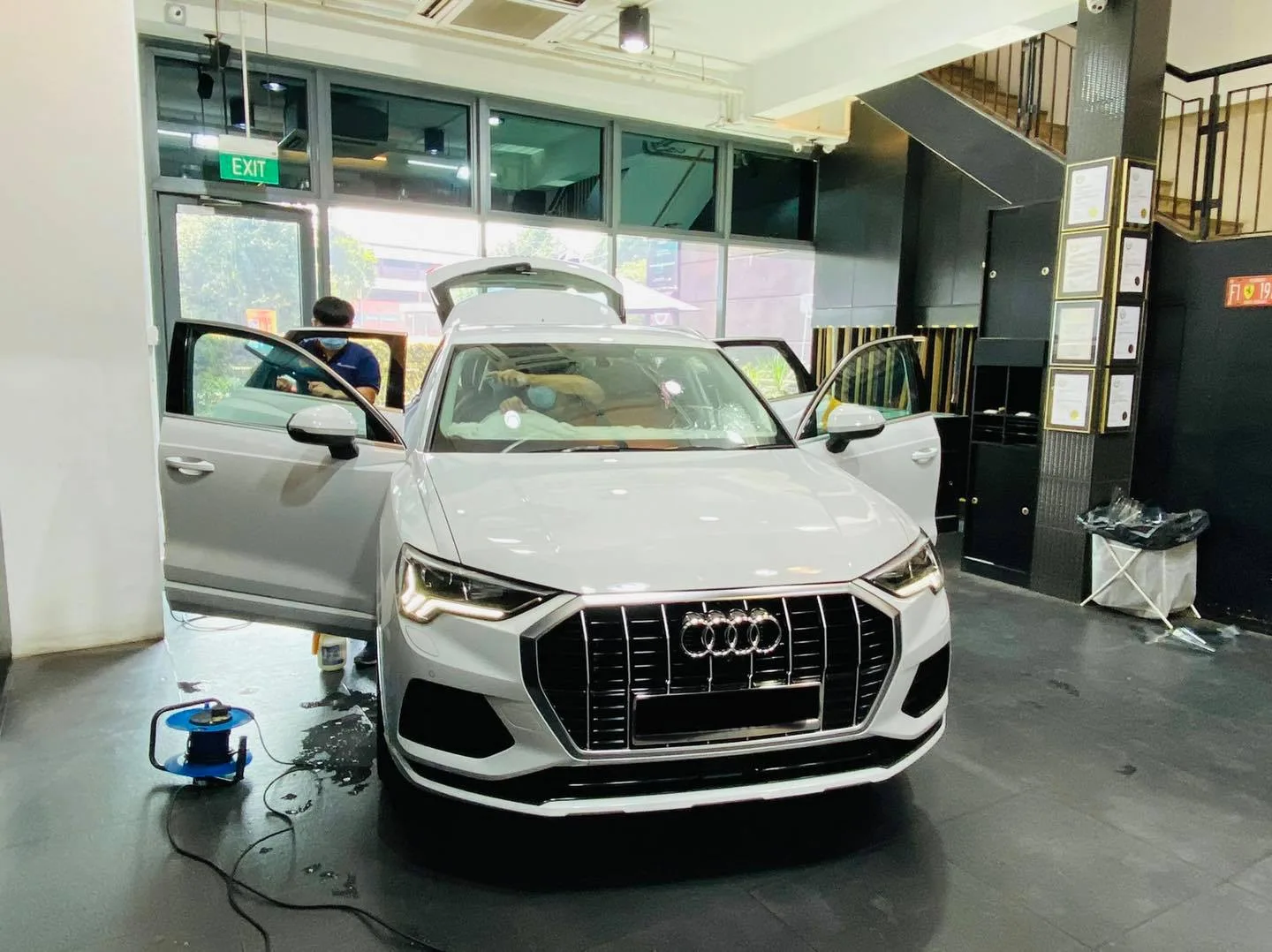 White Audi Q3 SUV with doors open for window film at Infratint Singapore