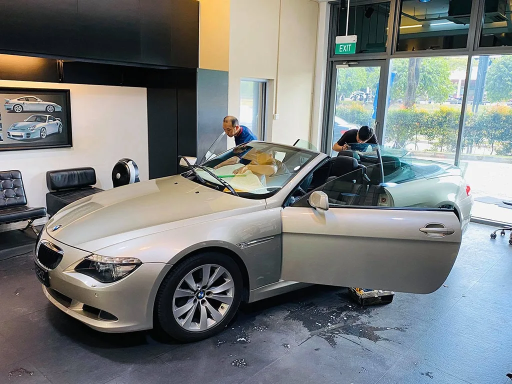 Champagne BMW 6 Series cabriolet having windscreen film fitted at Infratint Singapore
