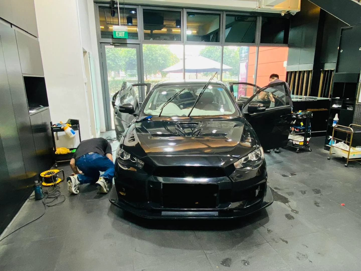 Black Mitsubishi Lancer Evo at Infratint Singapore for window film