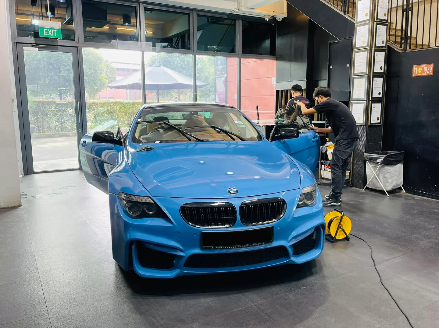 Light blue BMW 6 Series coupe being window tinted at Infratint Singapore