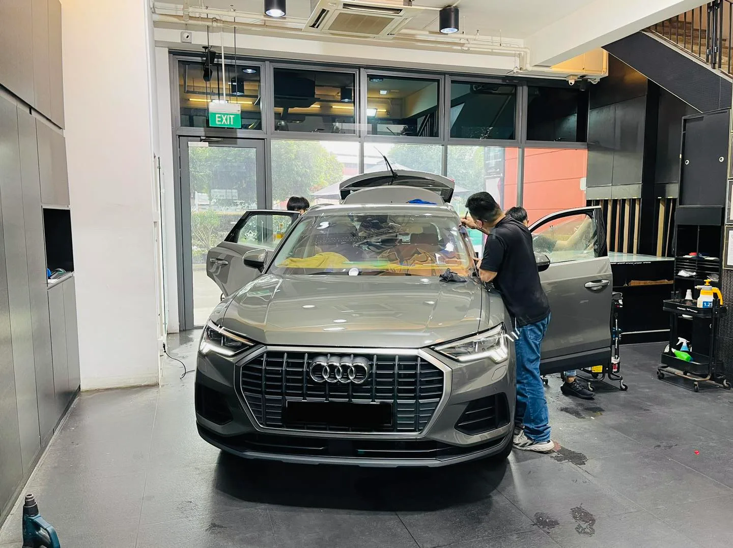 Grey Audi Q3 SUV with tailgate open at Infratint Singapore for window film