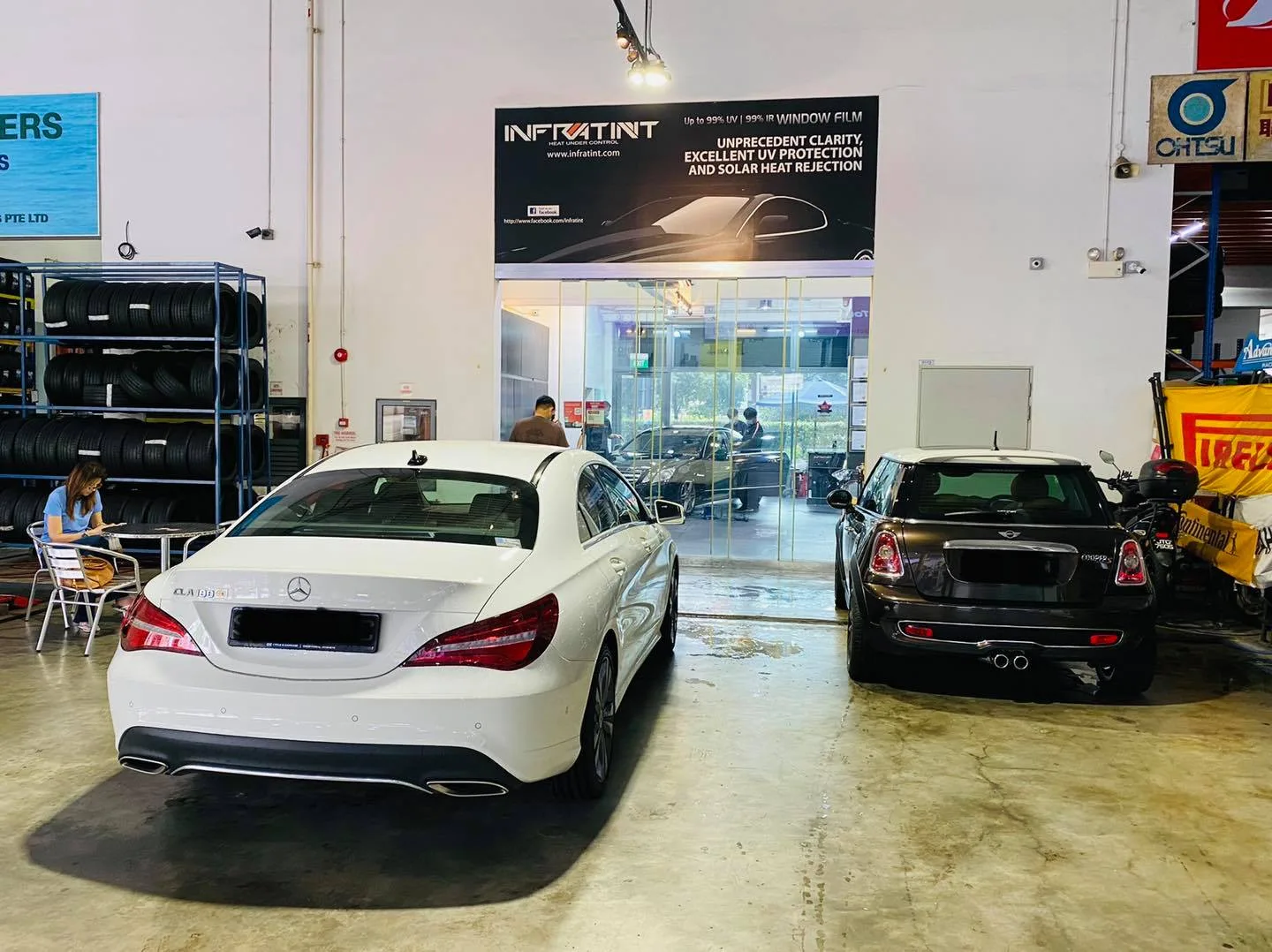 White Mercedes-Benz CLA and black Mini parked rear-on at Infratint Singapore