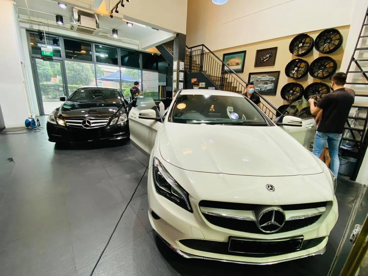 White Mercedes-Benz CLA front view inside the Infratint Singapore install bay