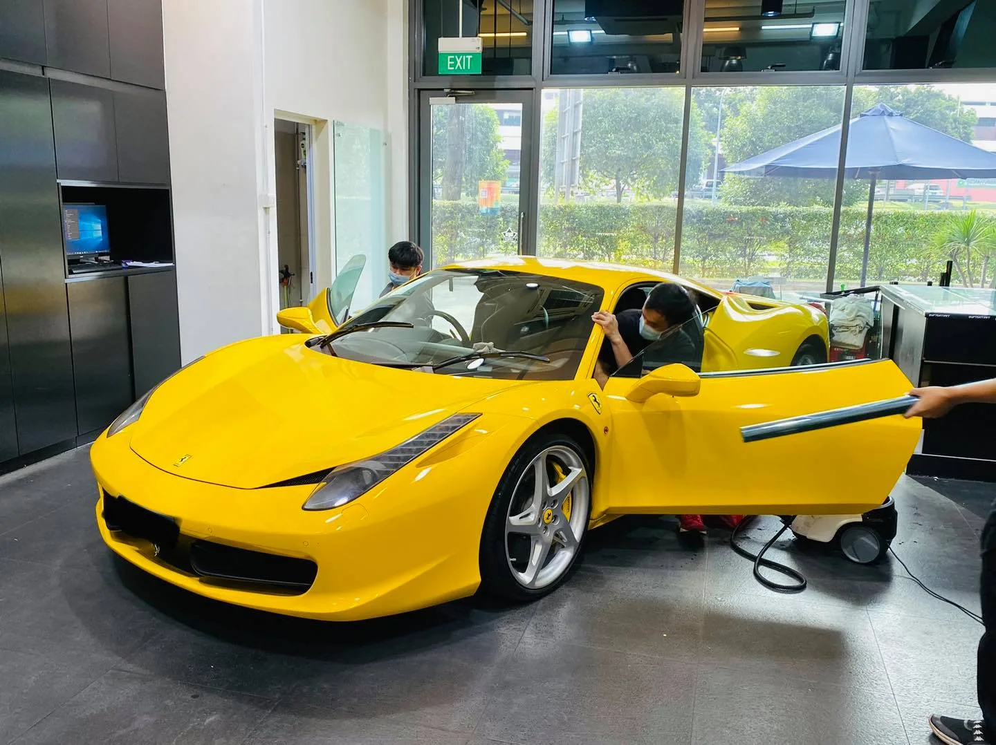 Yellow Ferrari 458 side view during tinting at Infratint Singapore