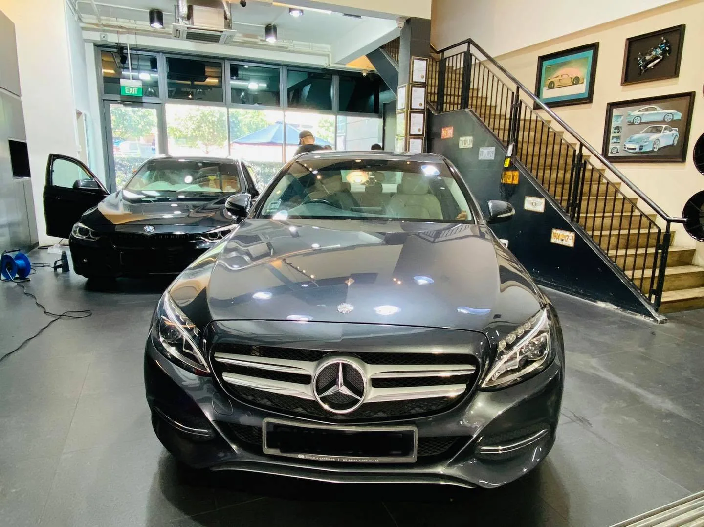 Front view of a grey Mercedes-Benz C-Class with a BMW behind it at Infratint Singapore