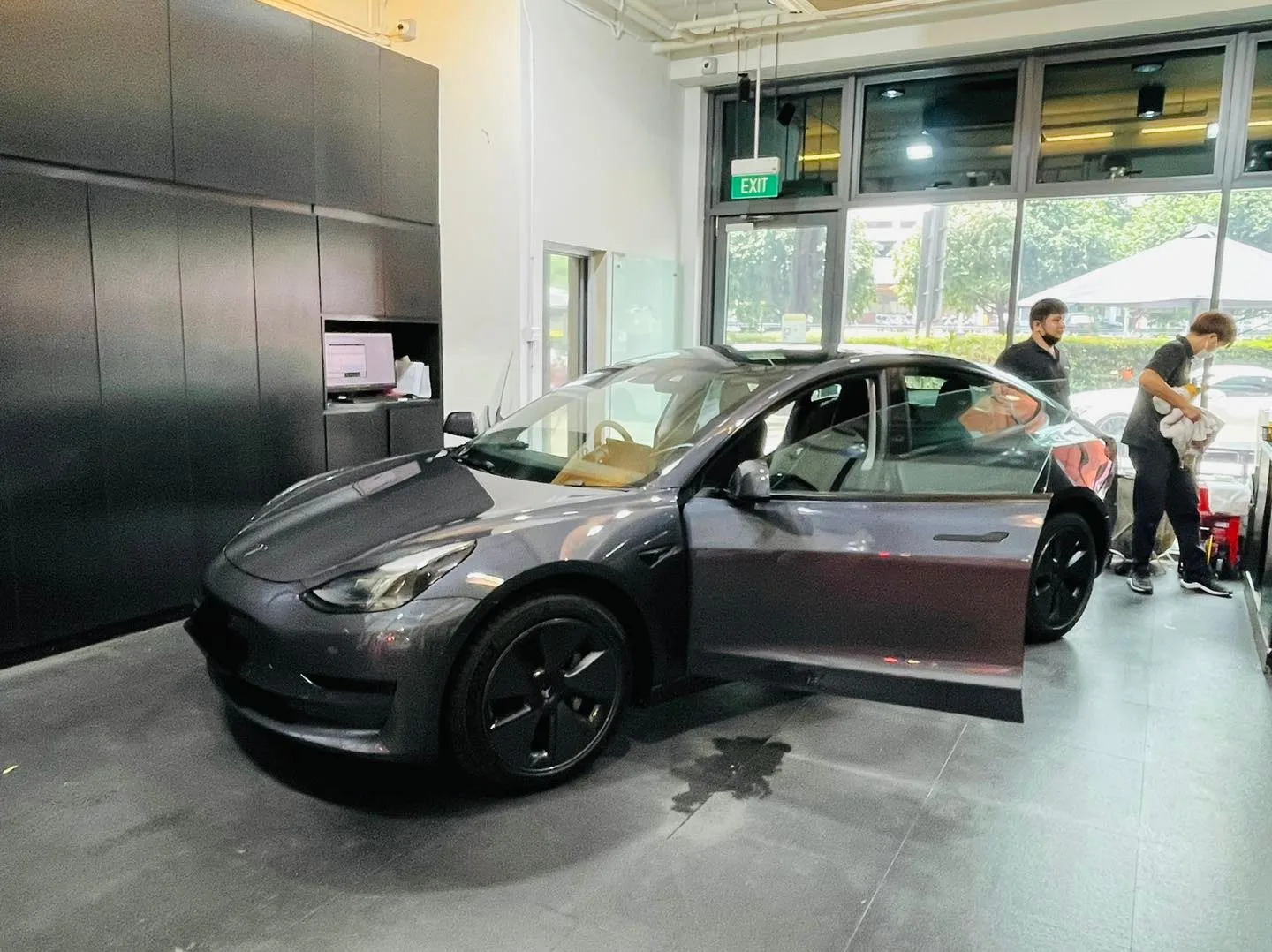 Dark grey Tesla Model 3 during window tinting at Infratint Singapore
