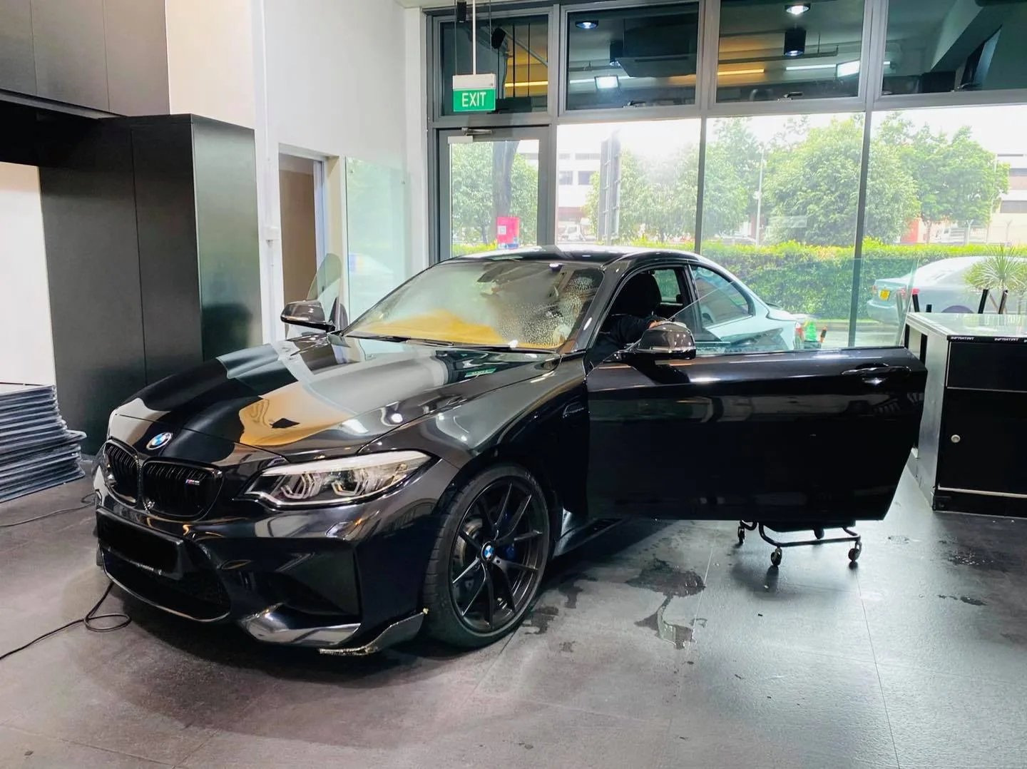 Black BMW 2 Series coupe in three-quarter view at Infratint Singapore