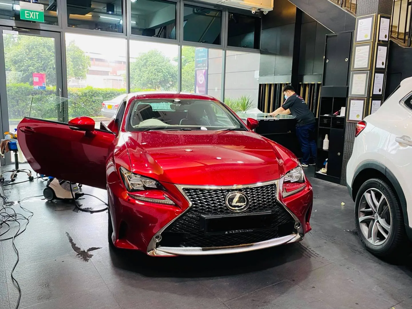 Red Lexus RC coupe with door open at Infratint Singapore for window film