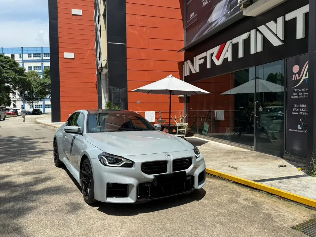 Tinted grey BMW M2 front three-quarter view outside Infratint Singapore