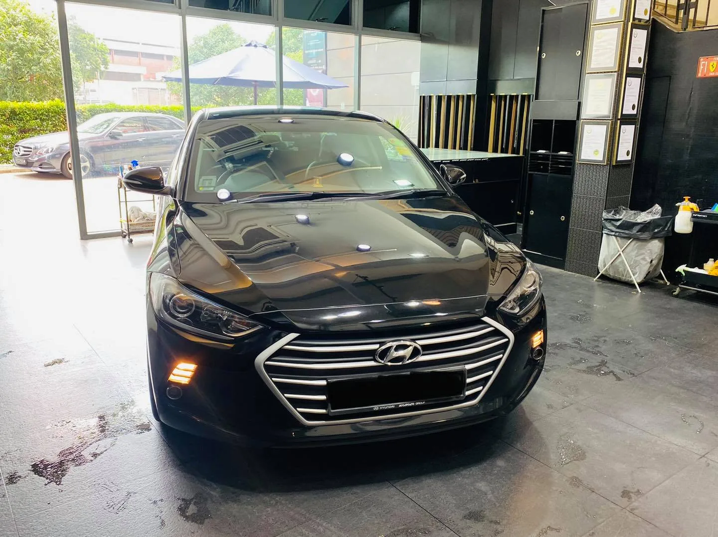 Black Hyundai Elantra front view inside the Infratint Singapore showroom