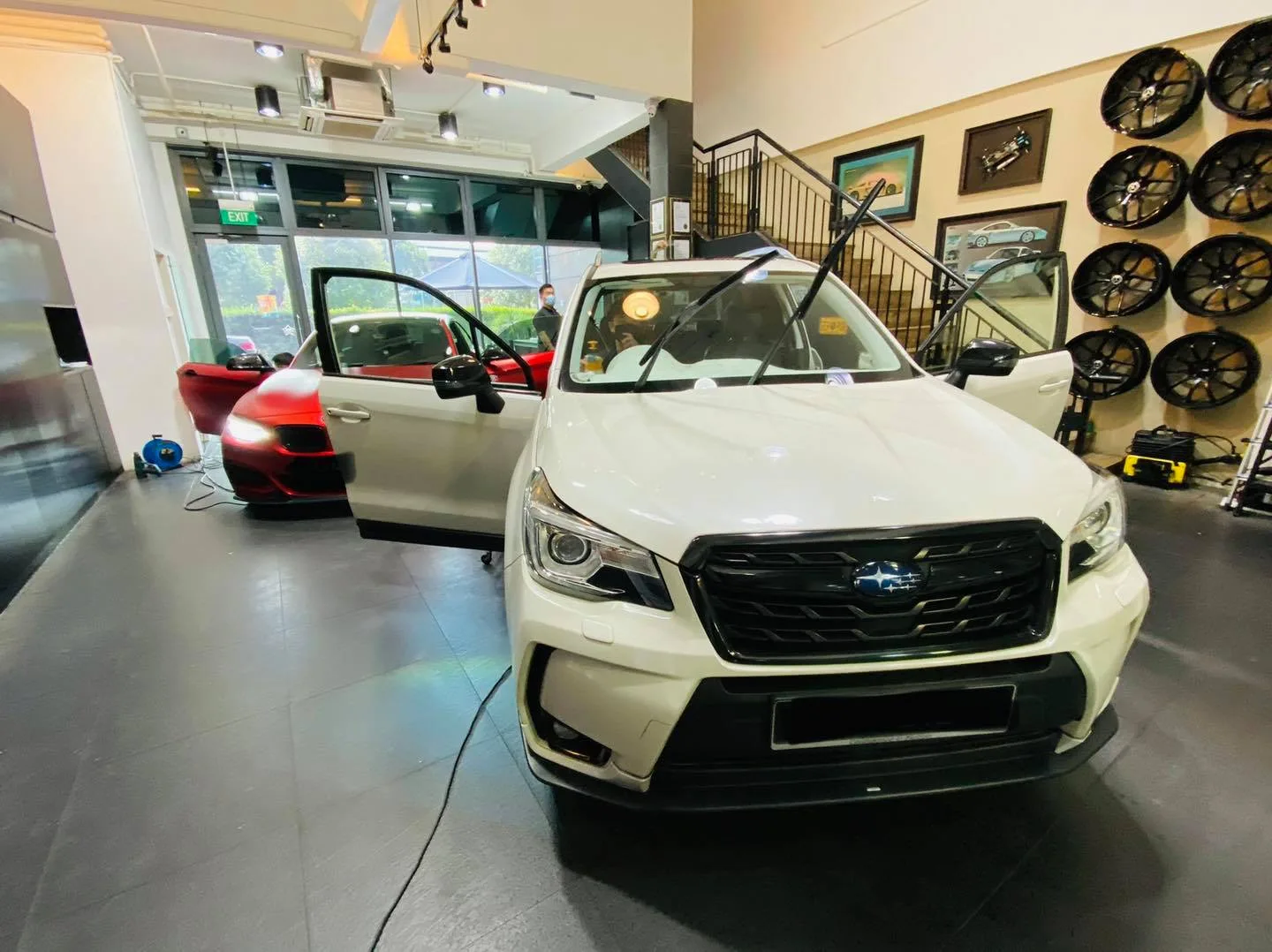 White Subaru Forester inside the Infratint Singapore showroom for window tinting
