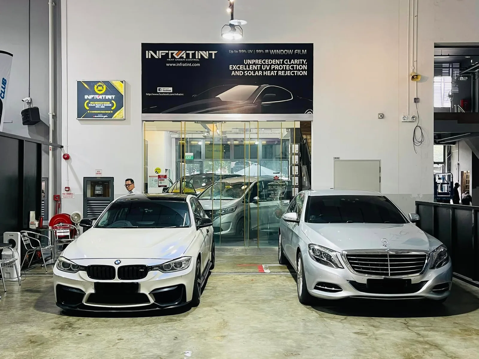 White BMW M car and silver Mercedes-Benz S-Class parked at Infratint Singapore