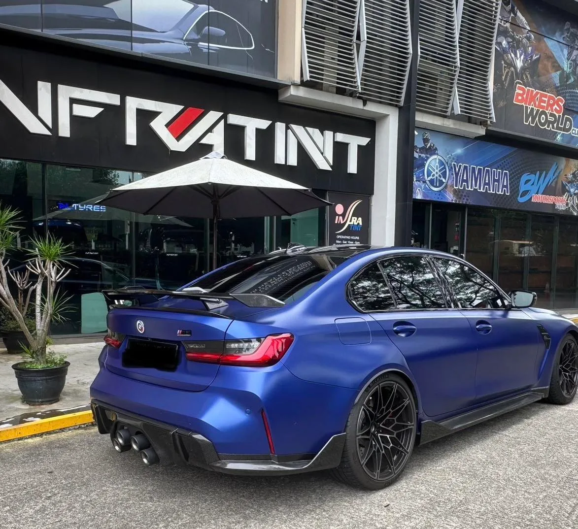 Matte blue BMW M3 rear three-quarter view with tinted glass at Infratint Singapore