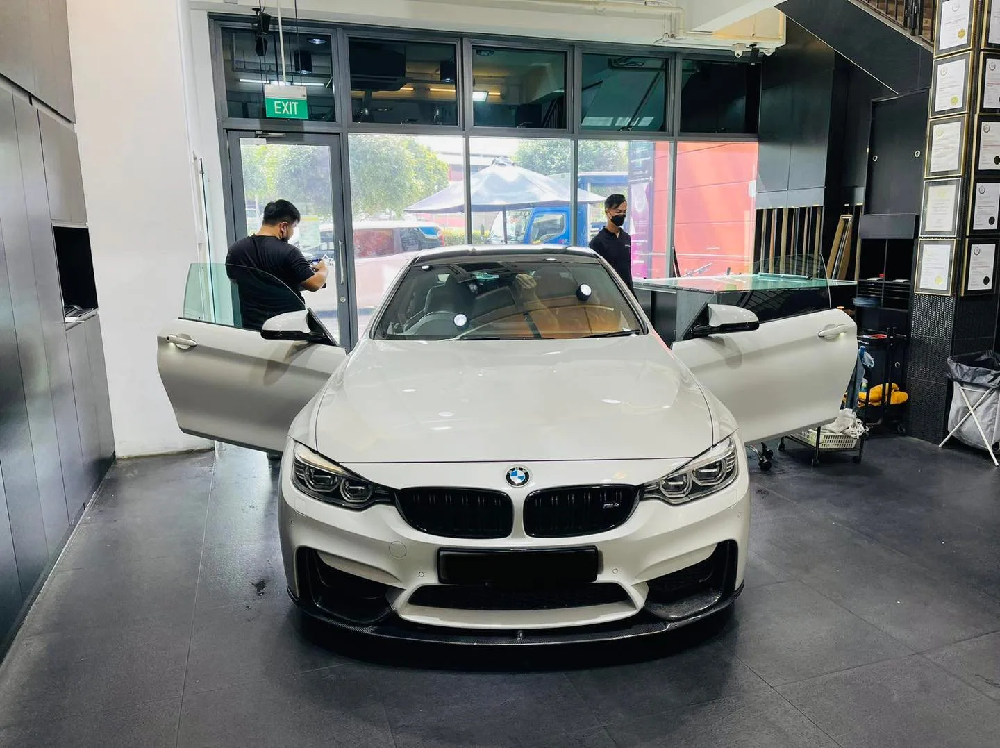 White BMW M4 coupe having its windows tinted at Infratint Singapore