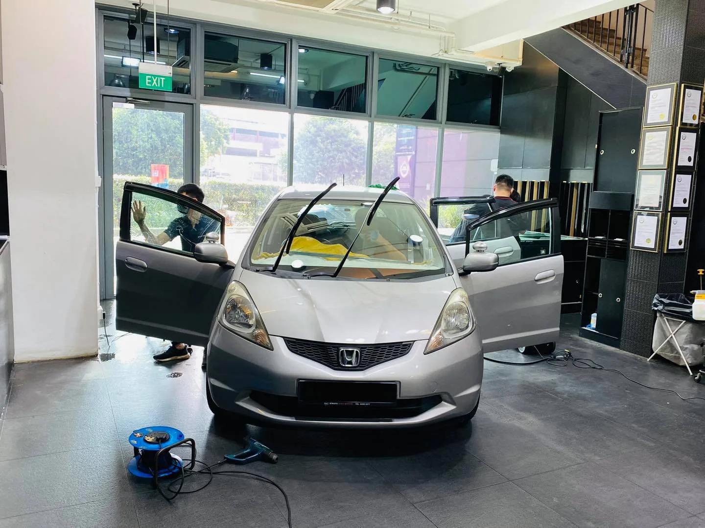 Silver Honda hatchback having its windows tinted at Infratint Singapore