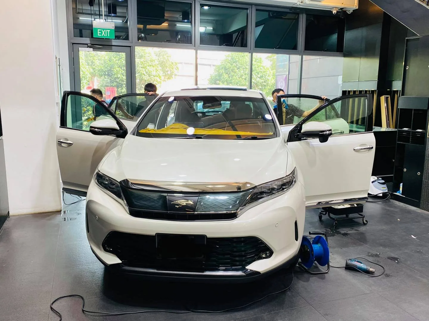 White Toyota SUV during window tinting at Infratint Singapore
