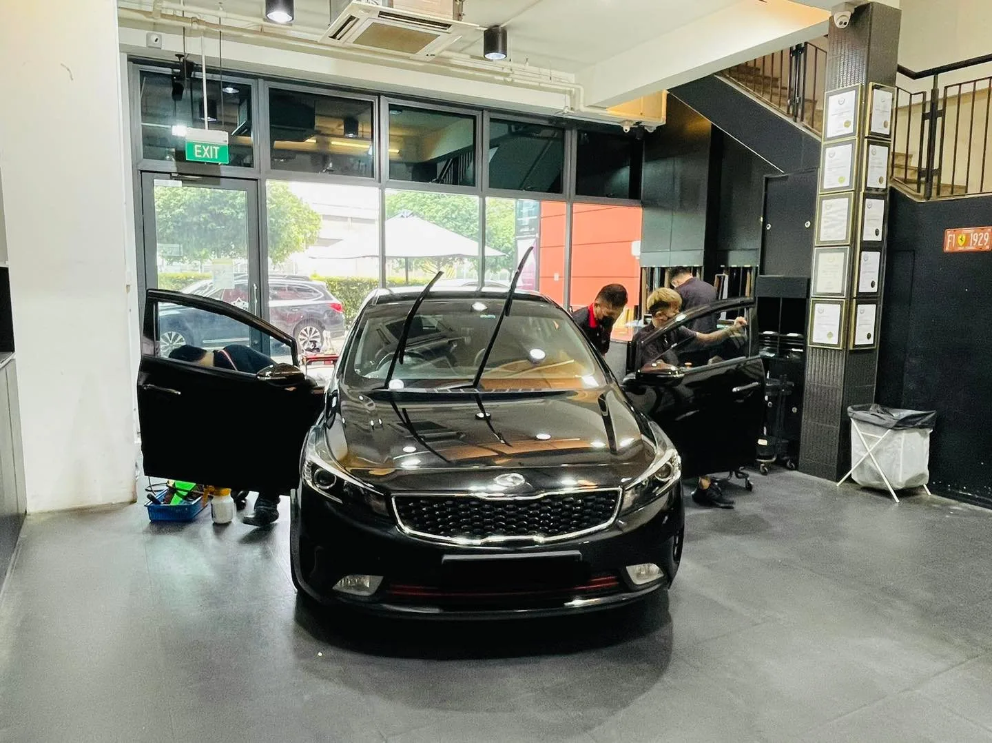 Black sedan having its windscreen tinted at Infratint Singapore