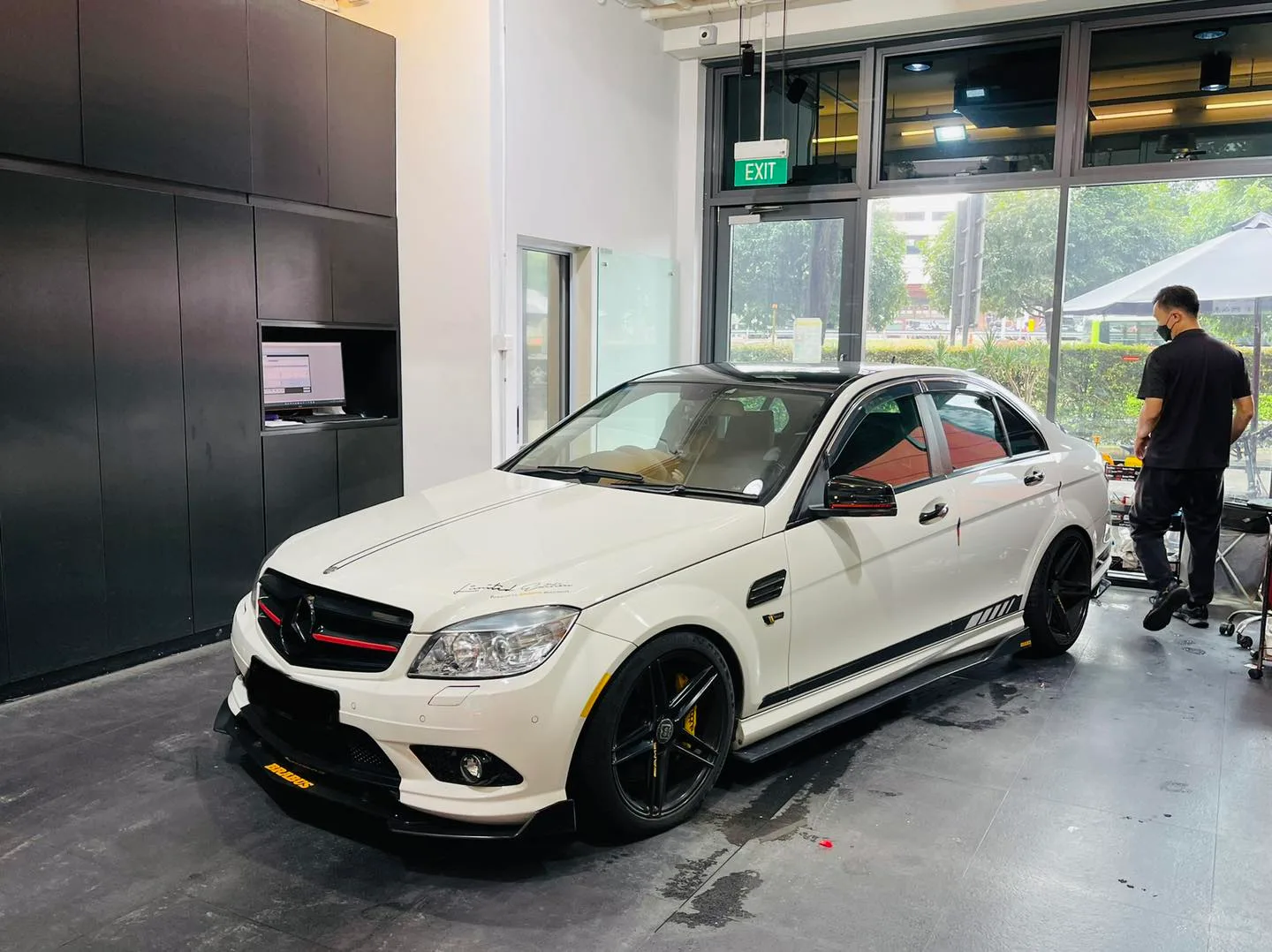 White Mercedes-Benz C-Class at a front three-quarter angle at Infratint Singapore
