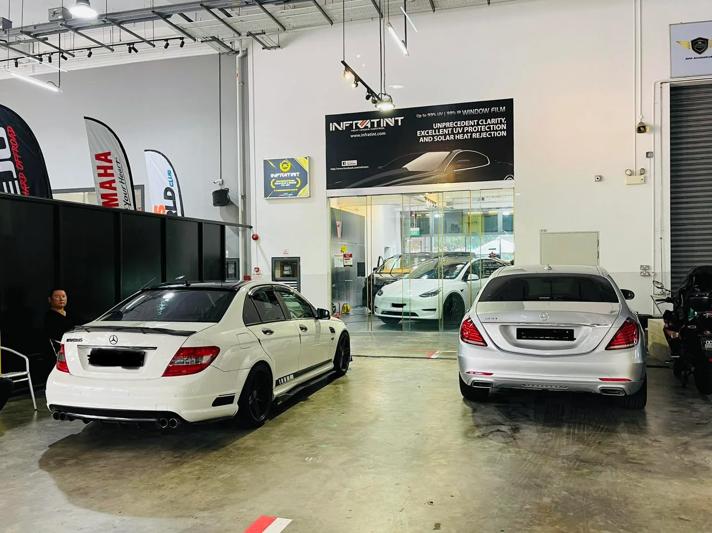 White Mercedes-Benz C-Class and silver S-Class at Infratint Singapore for window tinting