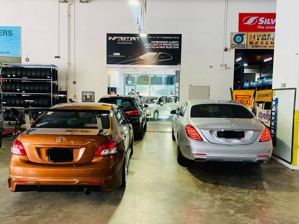 Bronze Toyota Vios and silver Mercedes-Benz S-Class at Infratint Singapore