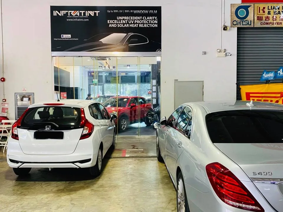 White Honda Jazz and silver Mercedes-Benz S-Class at Infratint Singapore