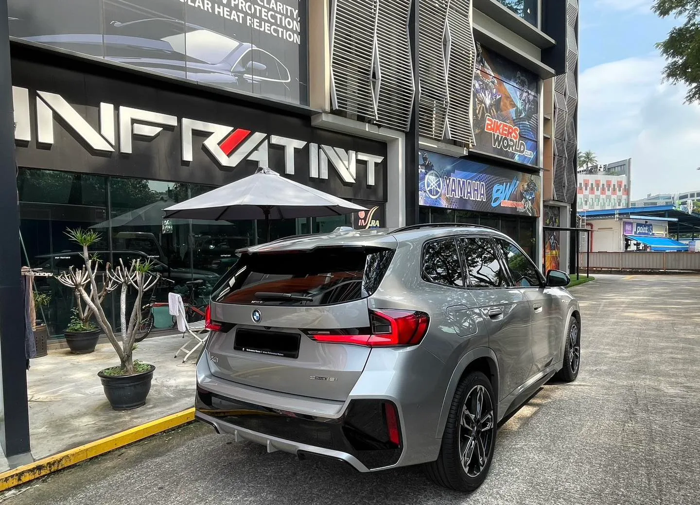 Tinted silver BMW X1 rear three-quarter view at Infratint Singapore