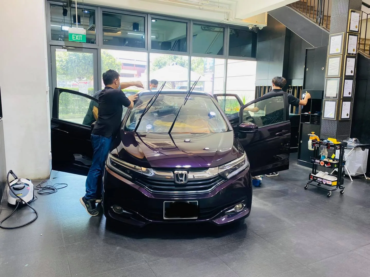 Dark purple Honda wagon being prepared for tinting at Infratint Singapore