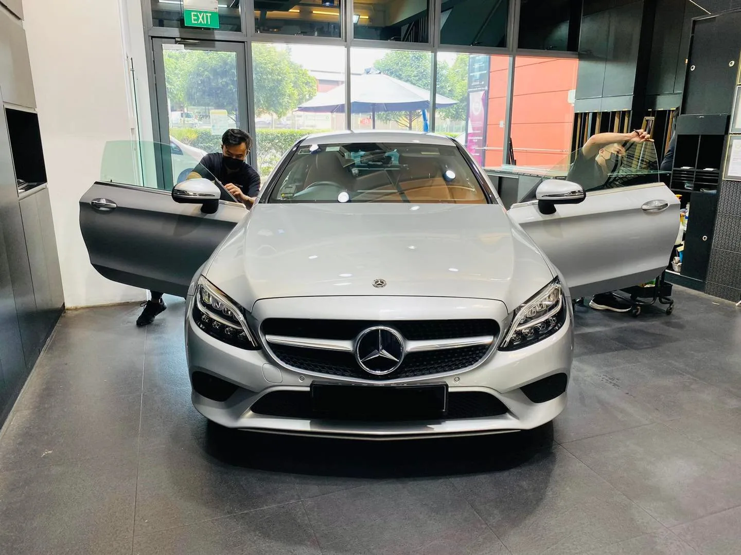 Silver Mercedes-Benz C-Class with doors open at Infratint Singapore for window film