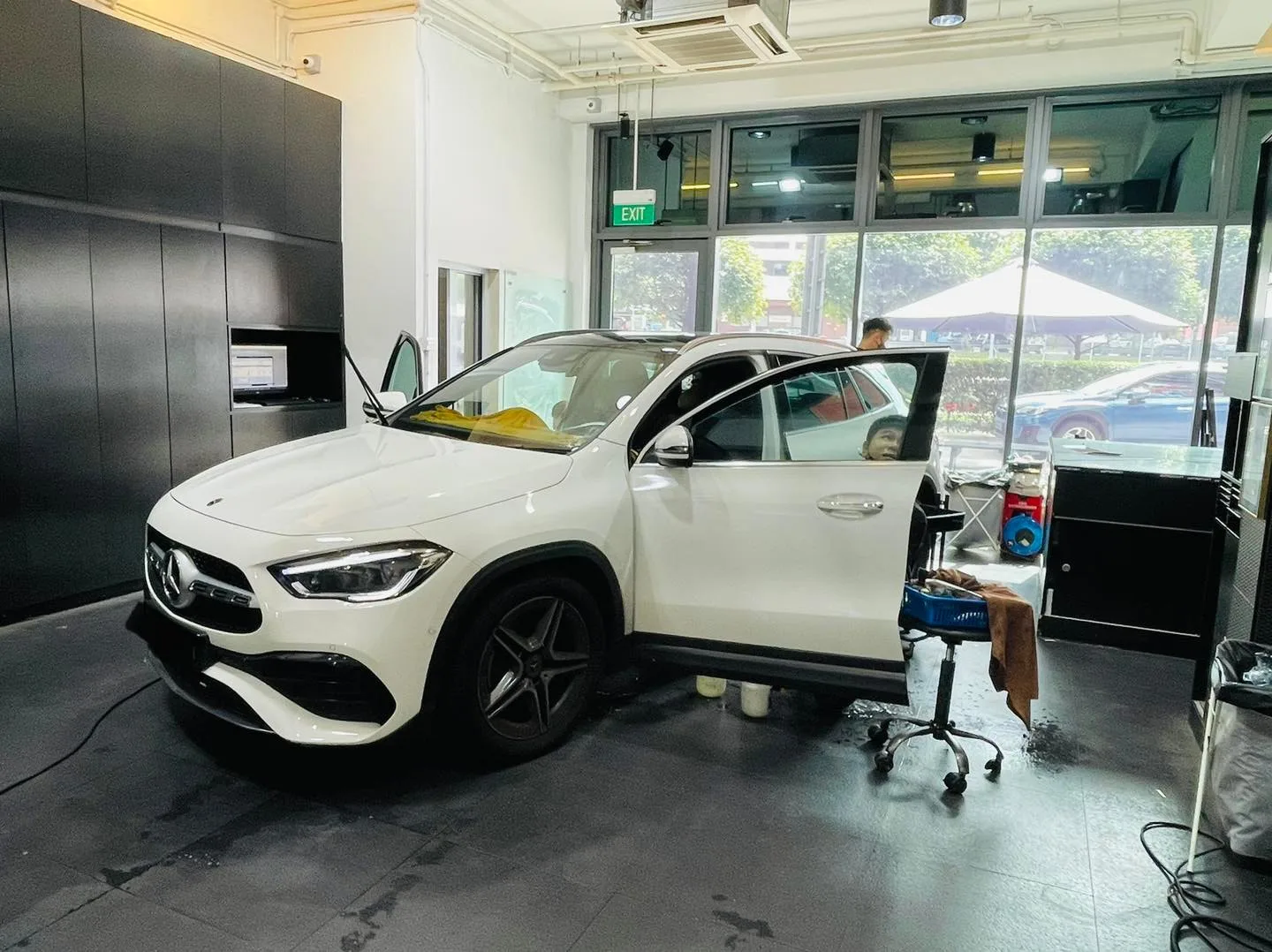 White Mercedes-Benz GLA SUV during window tinting at Infratint Singapore