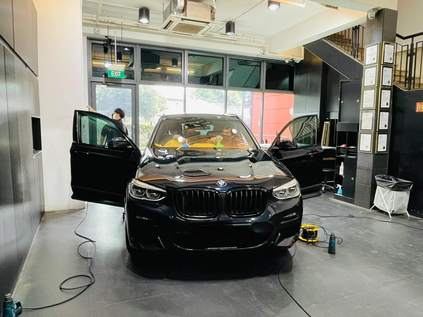 Black BMW X3 having its windows tinted at Infratint Singapore