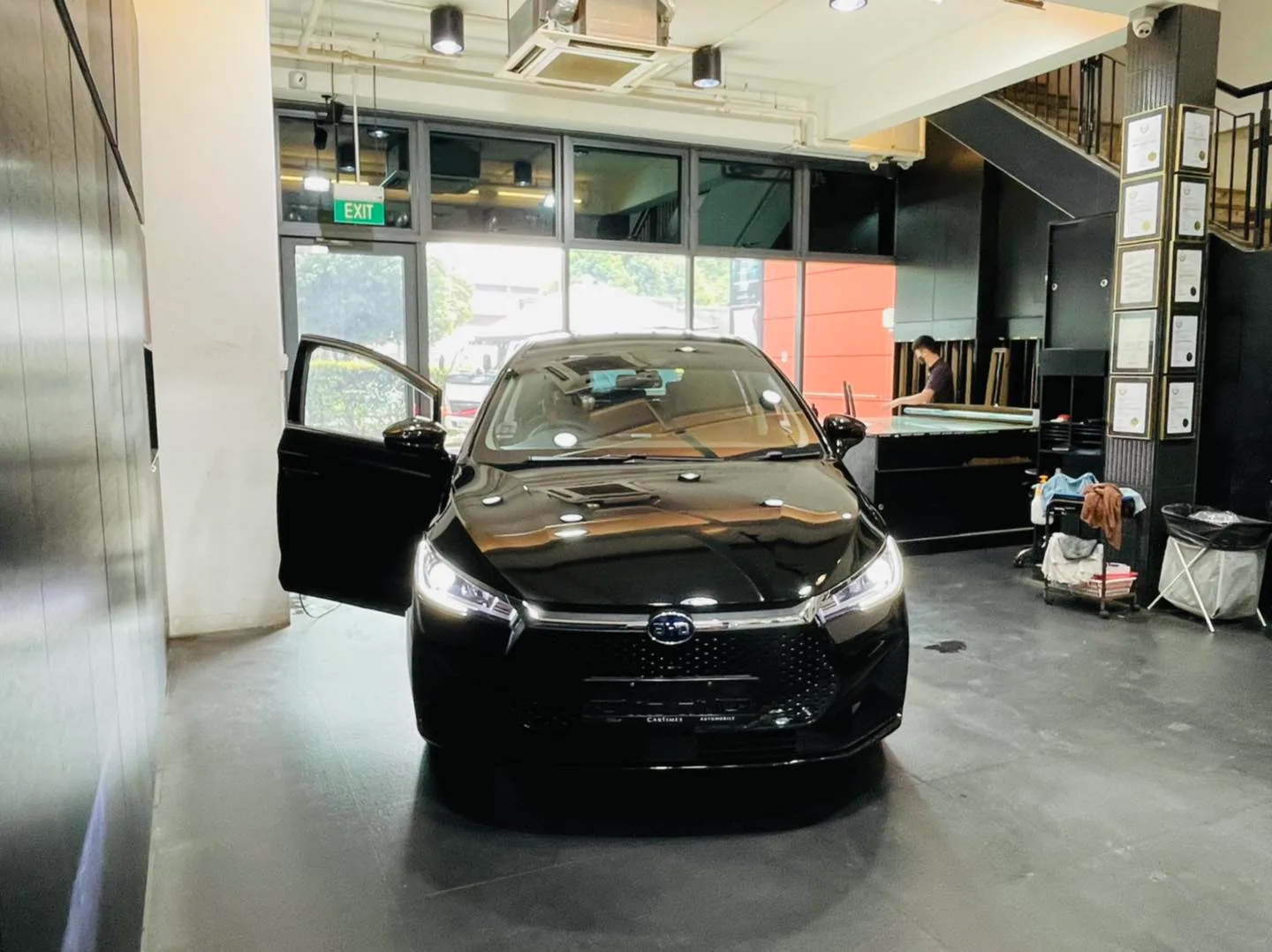 Black BYD MPV in the bay for window tinting at Infratint Singapore