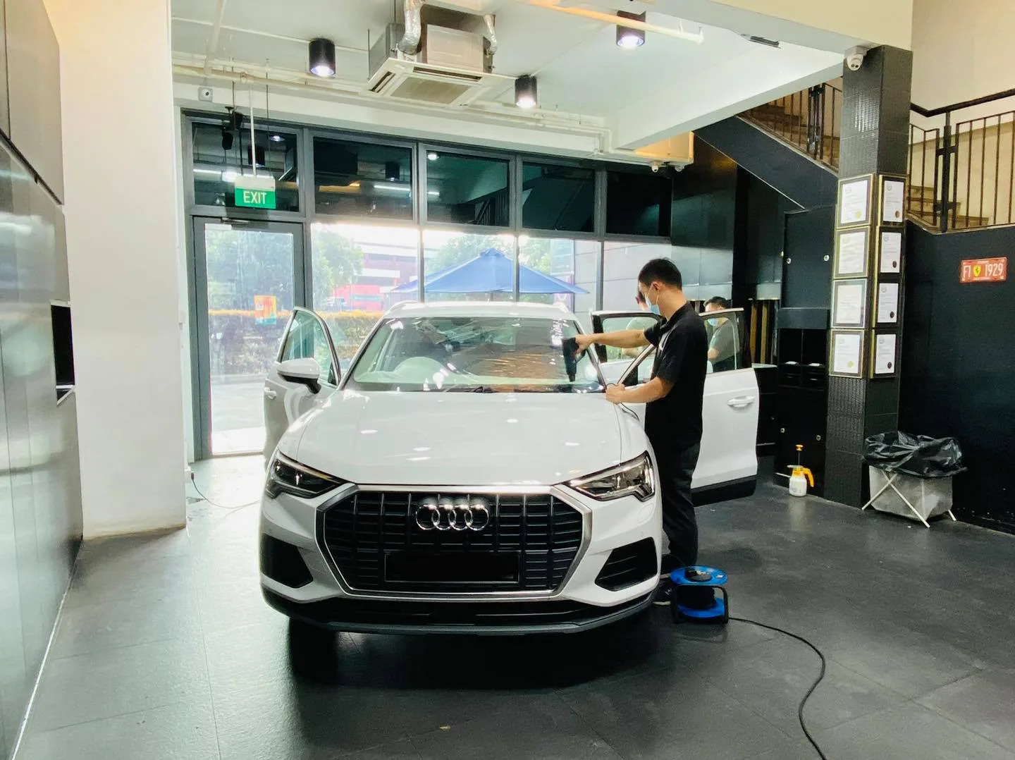 White Audi Q3 SUV getting window film fitted at Infratint Singapore