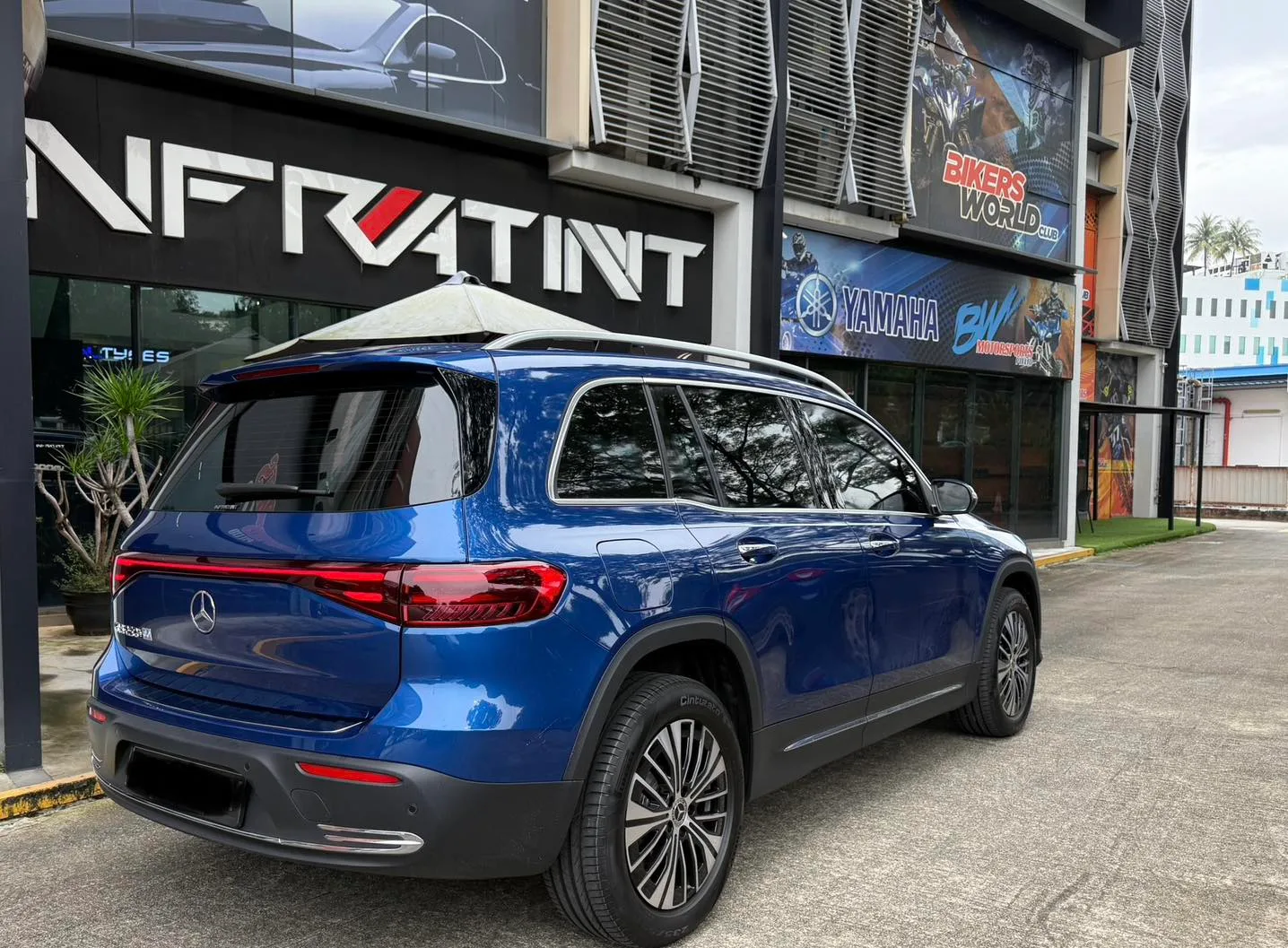 Blue Mercedes-Benz EQB rear three-quarter view with tinted tailgate at Infratint Singapore