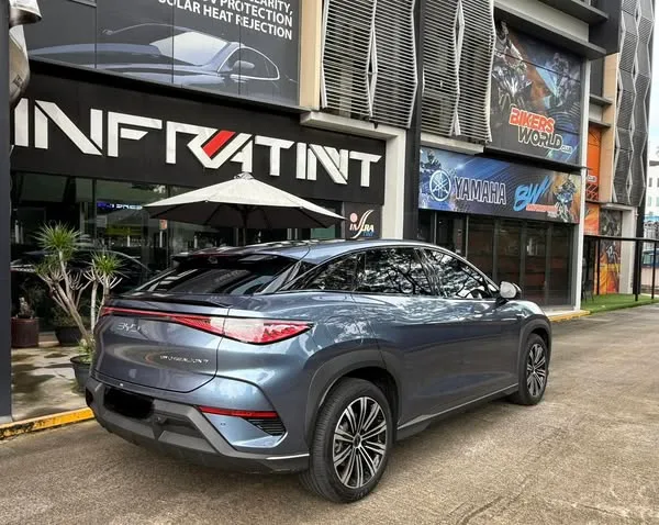 Tinted blue-grey BYD Sealion 7 rear three-quarter view at Infratint Singapore