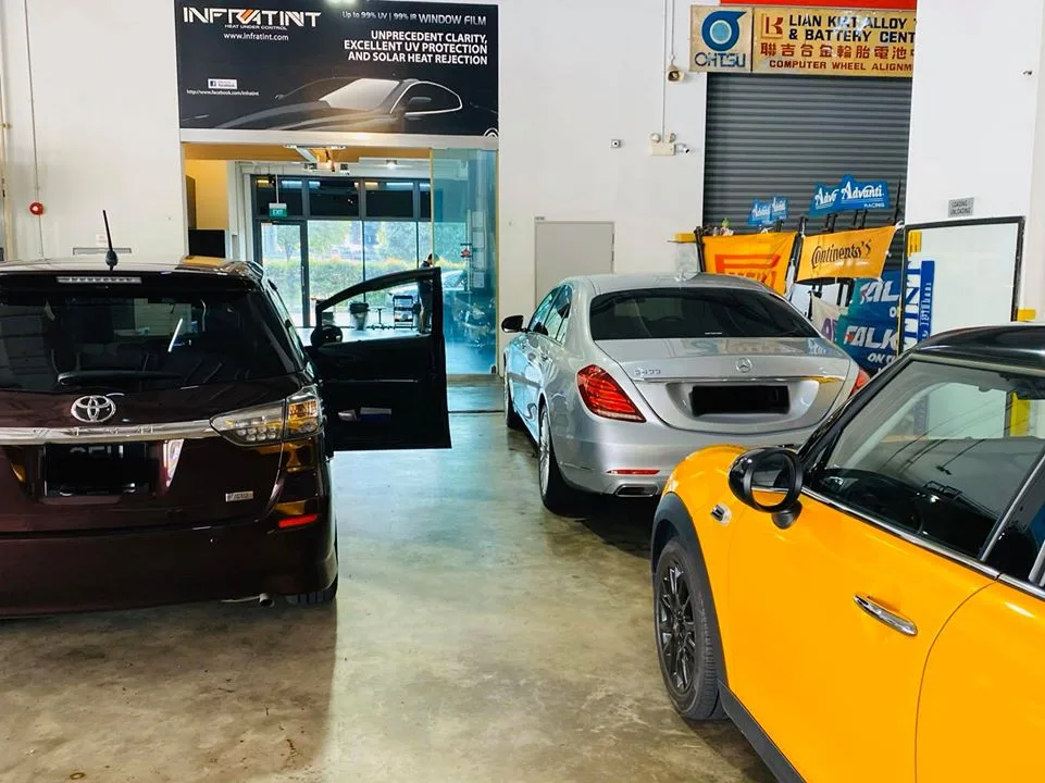 Toyota Harrier, Mercedes-Benz S-Class and orange Mini parked for tinting at Infratint Singapore