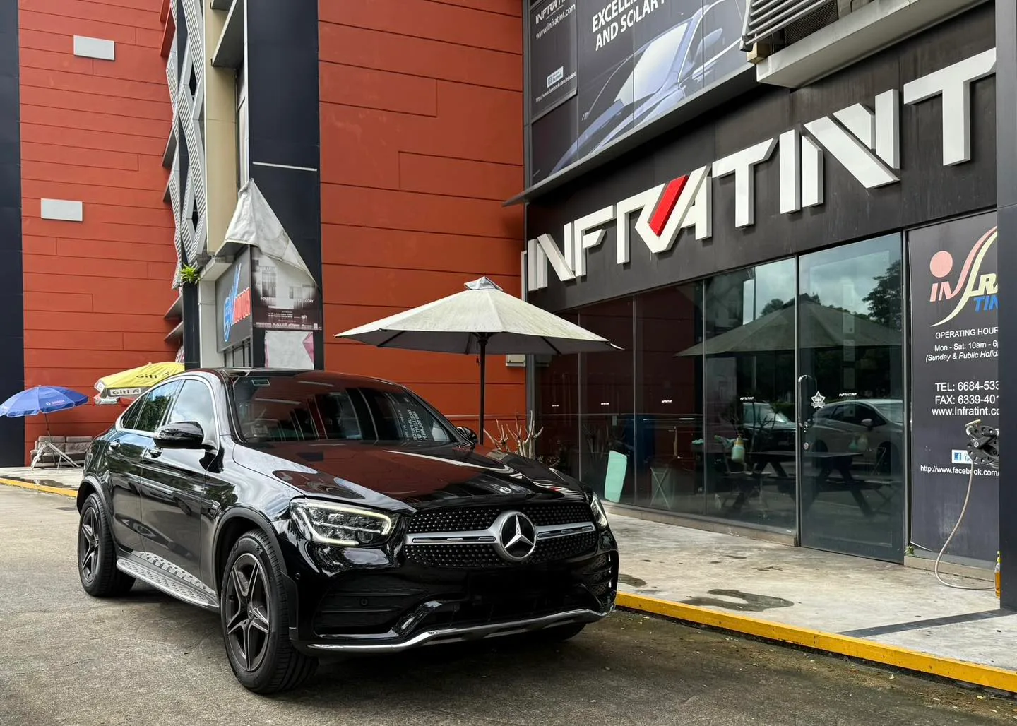 Black Mercedes-Benz GLC300 Coupe front three-quarter view outside Infratint Singapore