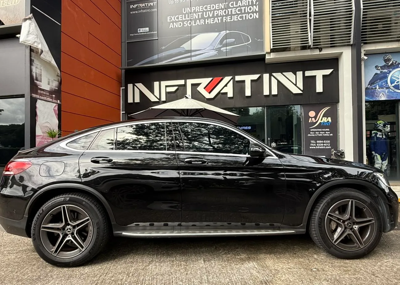 Mercedes-Benz GLC300 cognac leather interior seen through tinted glass at Infratint Singapore