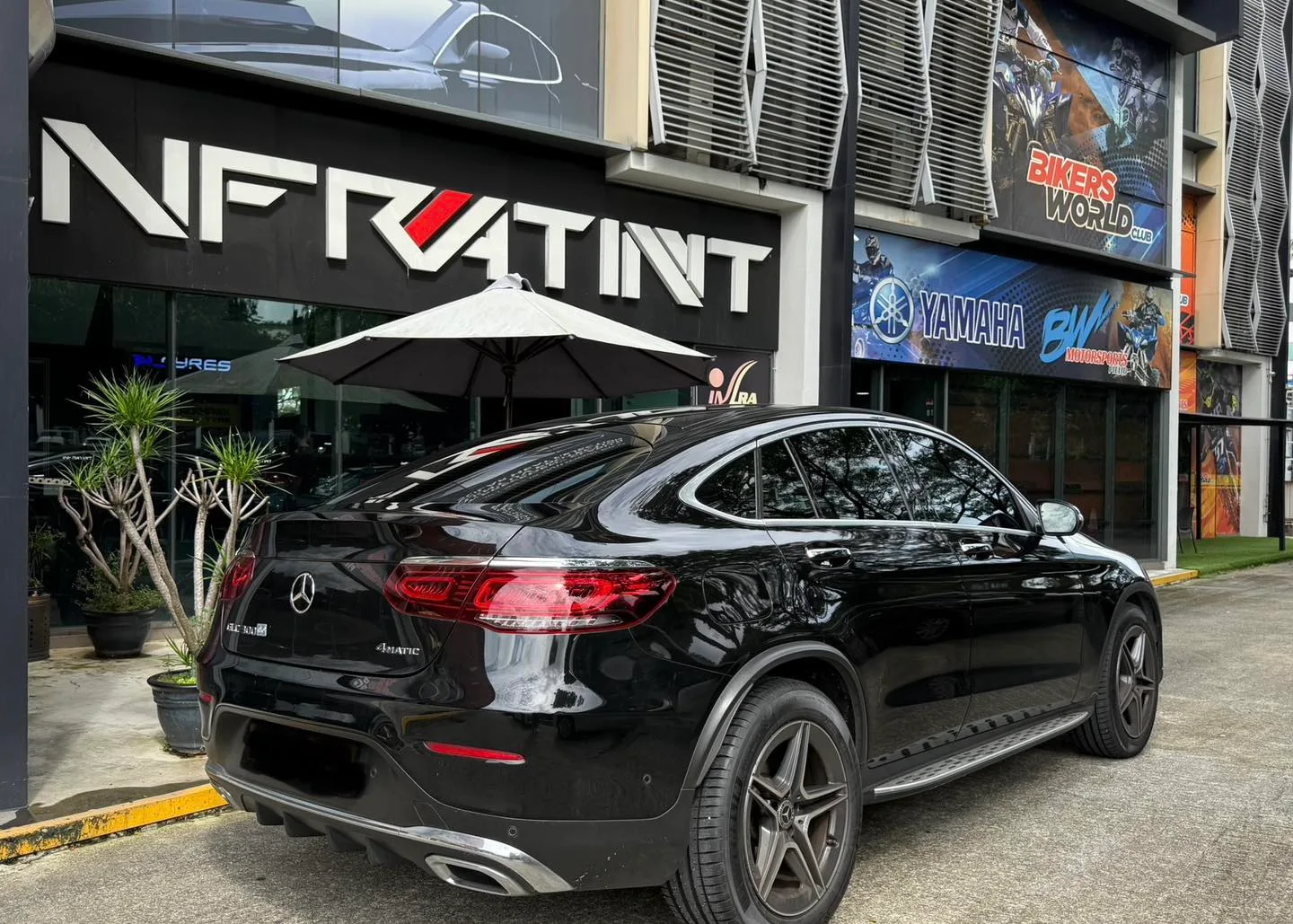 Black Mercedes-Benz GLC300 Coupe side profile outside Infratint Singapore