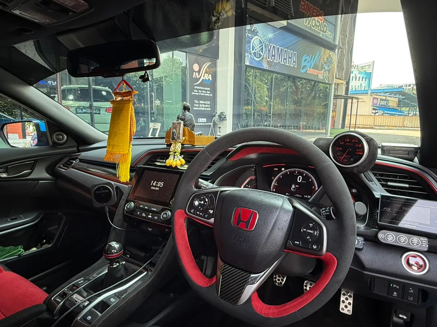 Honda Civic Type R interior and steering wheel seen through tinted glass at Infratint Singapore