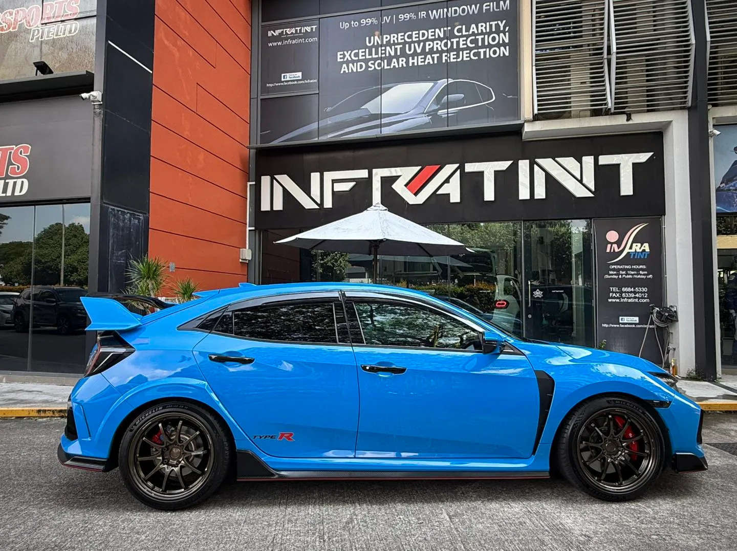 Blue Honda Civic Type R side profile with rear wing outside Infratint Singapore