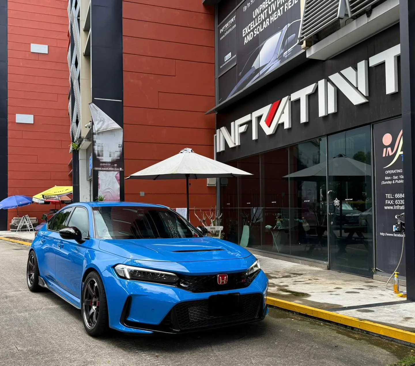 Blue 2024 Honda Civic Type R front three-quarter view outside Infratint Singapore