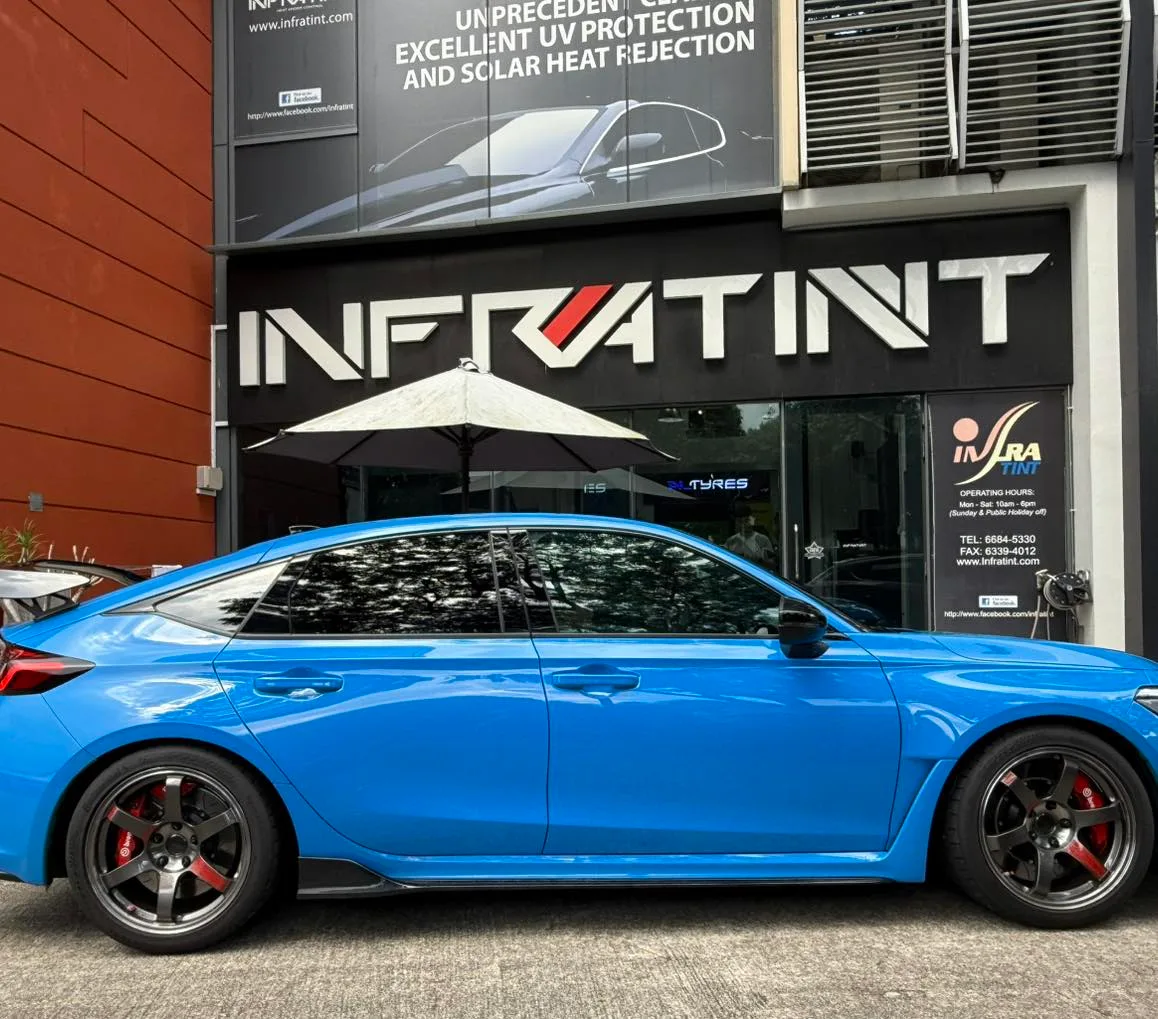 Blue 2024 Honda Civic Type R side profile with tinted windows at Infratint Singapore