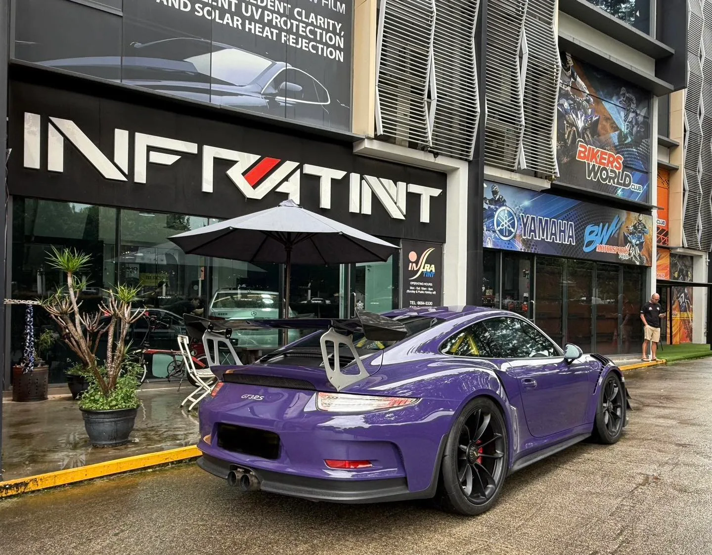 Tinted purple Porsche GT3 RS rear three-quarter view with rear wing at Infratint Singapore